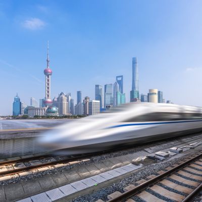 High,Speed,Train,With,Modern,Building,In,China